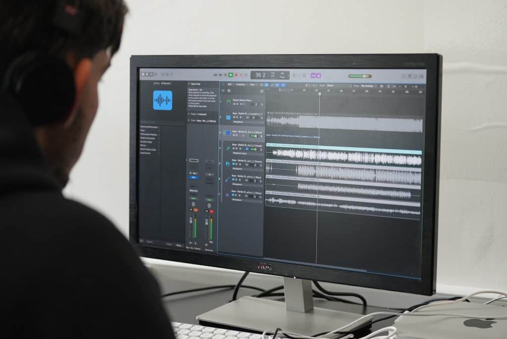A producer working on loop-based music in a digital audio workstation