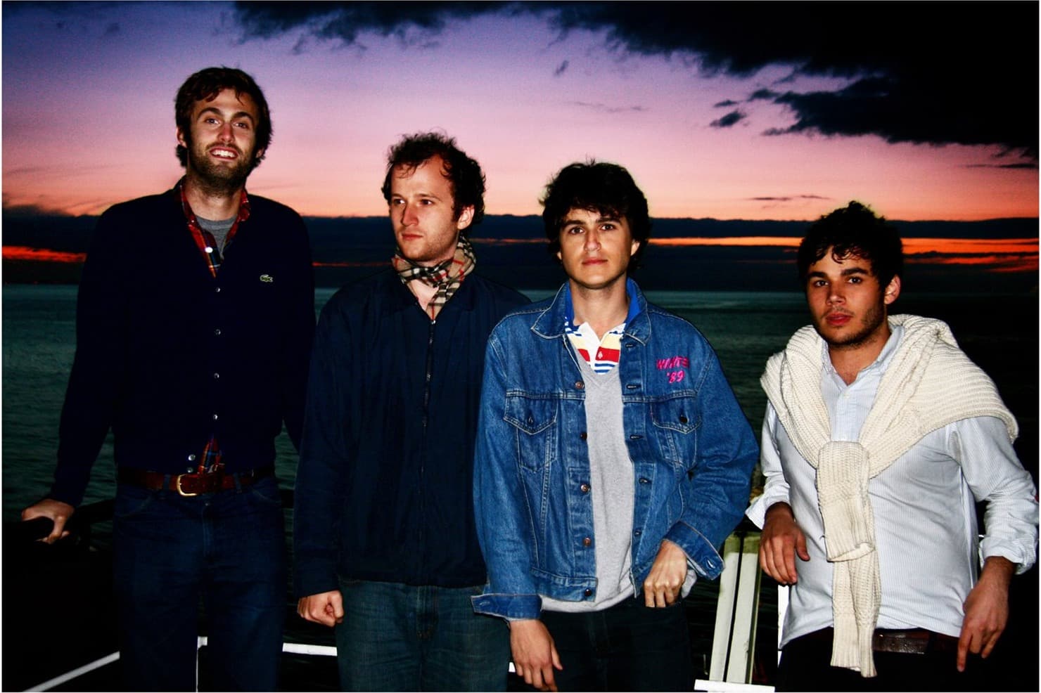 Vampire Weekend standing together at sunset